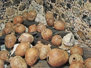 Ancient pots inside the cave clipart