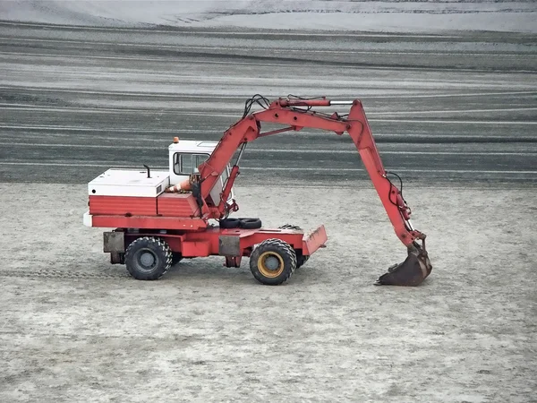 Excavator machine parked on the sand — Stock Photo, Image