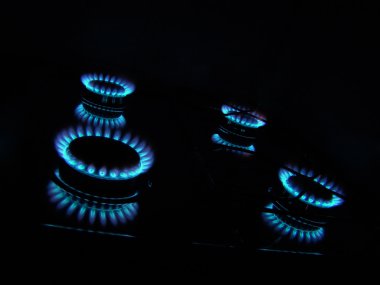 Flames of kitchen gas in the dark clipart