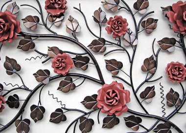 Wall decoration of metal flowers clipart