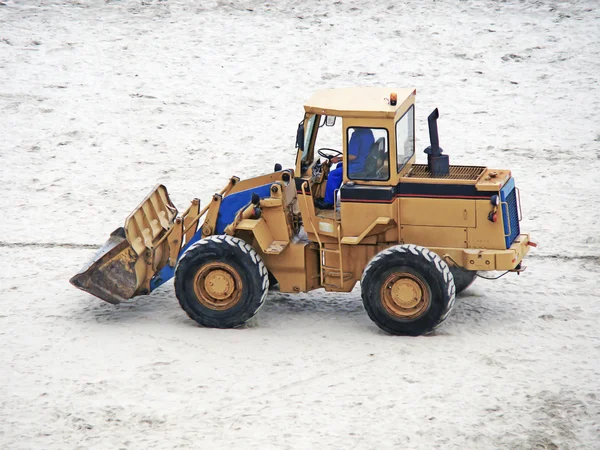 An excavator parked on the sand — Stock Photo, Image