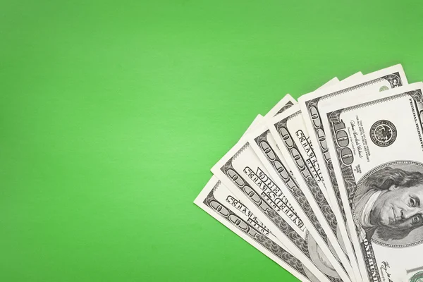 Деньги на зеленом фоне — стоковое фото