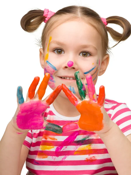 Portrait of a cute girl with painted hands — Stock Photo, Image