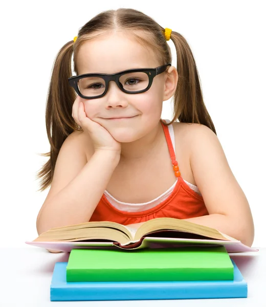 Cute little girl with books — Stock Photo, Image