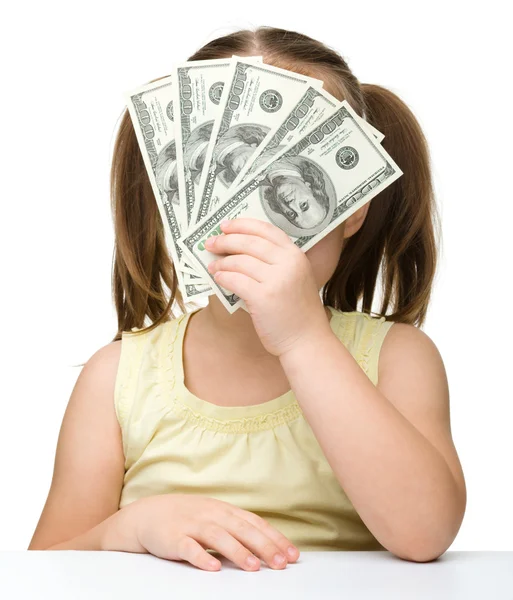 Cute little girl with dollars — Stock Photo, Image