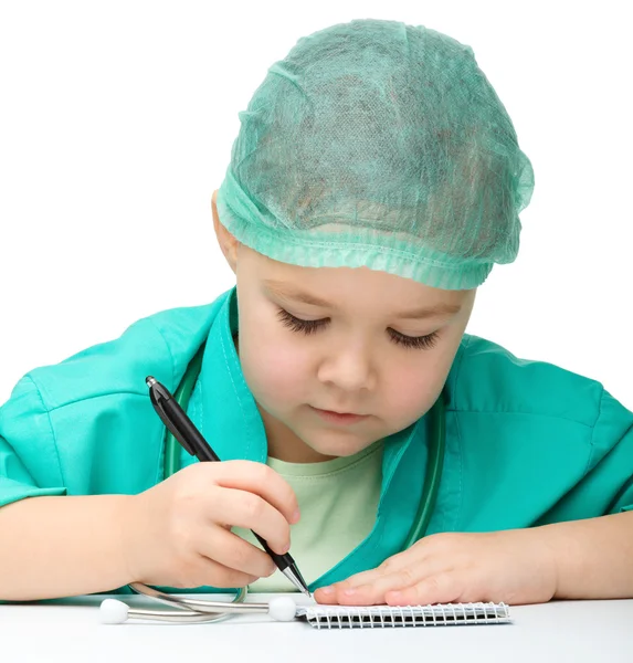 Cute little girl is playing doctor — Stock Photo, Image