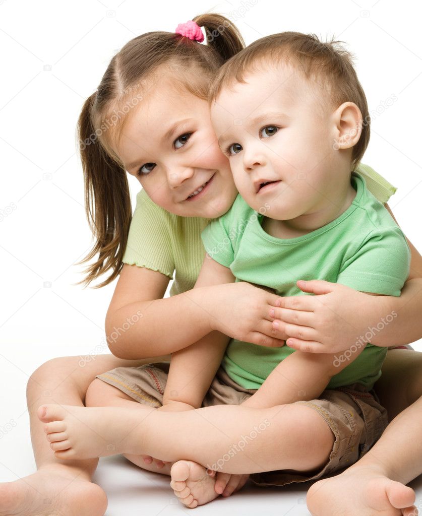 Two children (a girl and a boy) are having fun