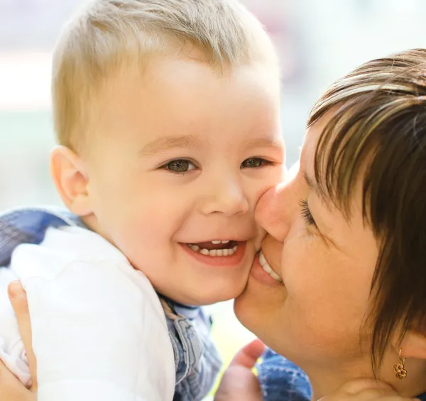 Portrait of a mother hugging her son — Stock Photo, Image