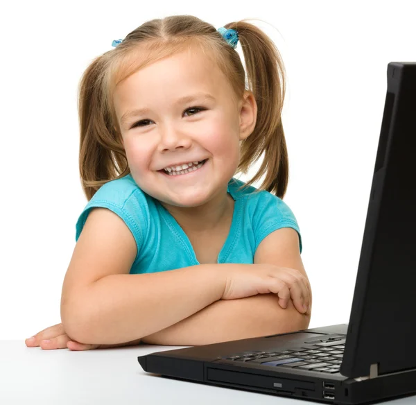 Little girl with laptop — Stock Photo, Image