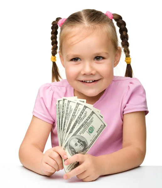 Fetiță drăguță cu bani de hârtie dolari — Fotografie, imagine de stoc