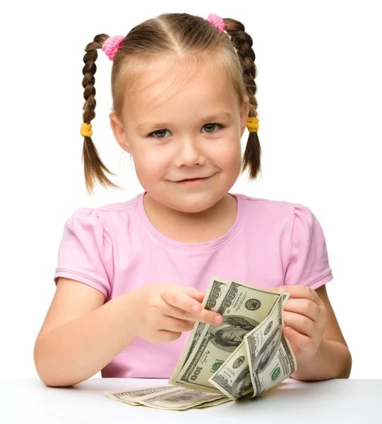 Roztomilá holčička s papírové peníze - dolary — Stock fotografie