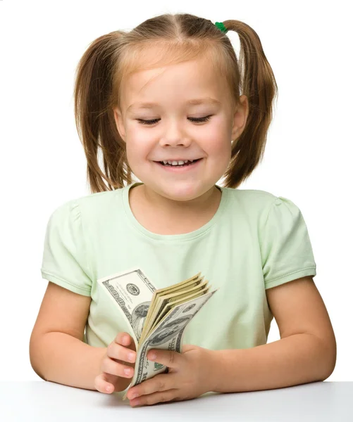 Schattig klein meisje met papieren geld - dollar — Stockfoto