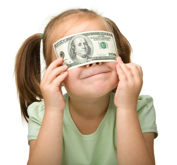 可爱的小女孩用纸钱-美元 — 图库照片