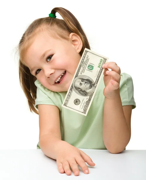 Menina bonito com dinheiro de papel - dólares — Fotografia de Stock