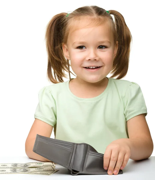 Søt liten jente med papirpenger dollar – stockfoto