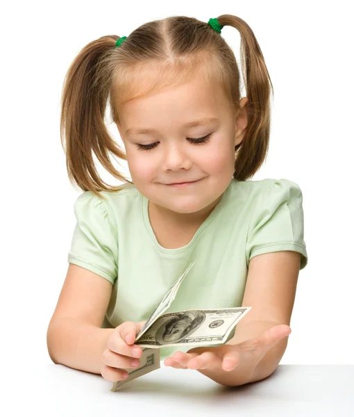 Menina bonito com dinheiro de papel - dólares — Fotografia de Stock
