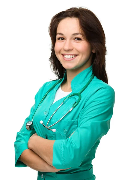 Jonge aantrekkelijke vrouw dragen van een uniform arts — Stockfoto