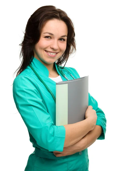 Young attractive woman wearing a doctor uniform — Stock Photo, Image