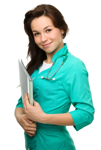 Young attractive woman wearing a doctor uniform — Stock Photo, Image