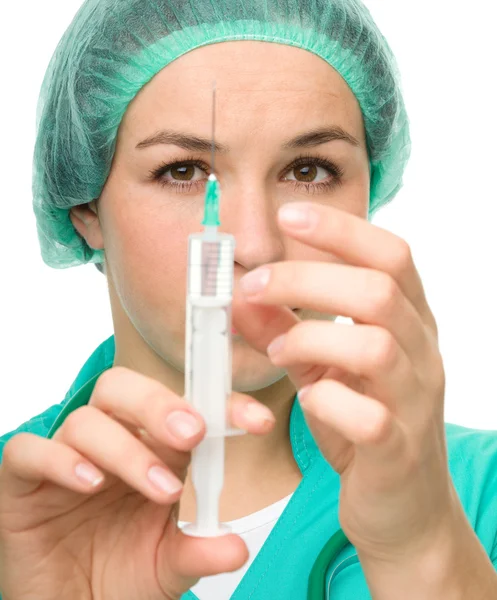 Young nurse is preparing syringe for injection — Stock Photo, Image