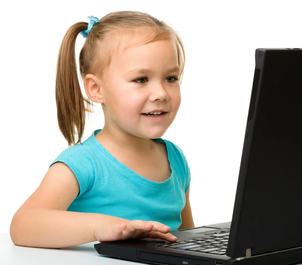 Little girl with laptop Royalty Free Stock Photos