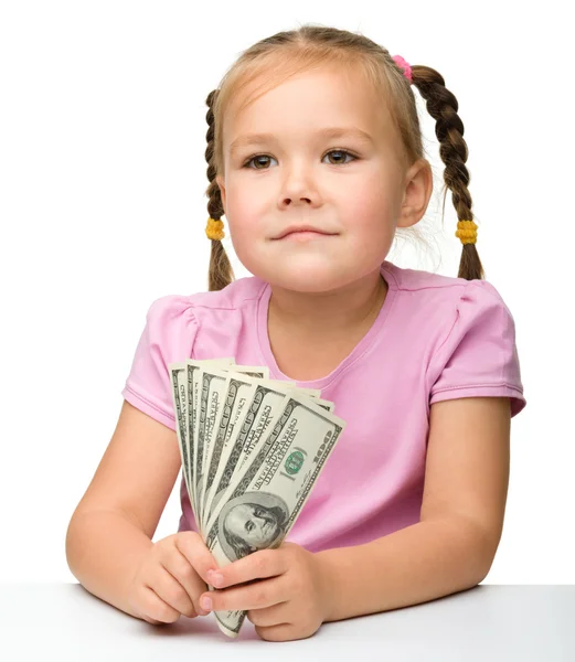 Χαριτωμένο κοριτσάκι με χαρτονόμισμα - δολάρια — Φωτογραφία Αρχείου