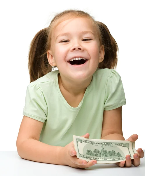 Cute little girl with paper money - dollars — Stock Photo, Image
