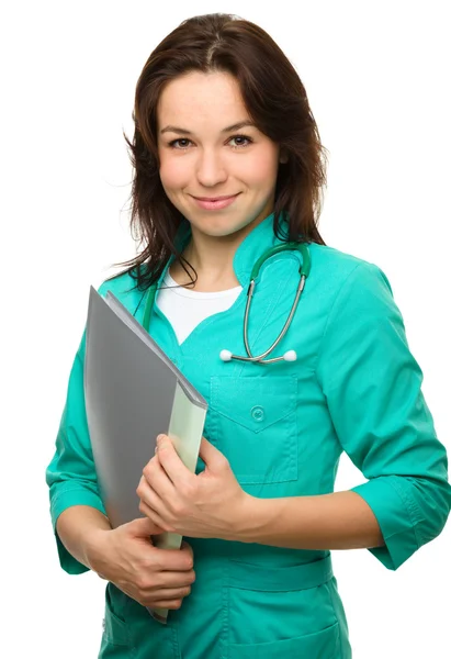 Young attractive woman wearing a doctor uniform — Stock Photo, Image