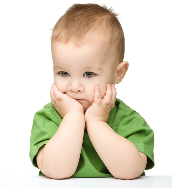 Pensive little boy support his head with hands — Stock Photo, Image