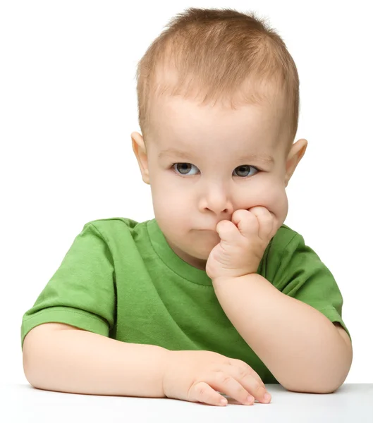 Pensive little boy support his head with hands — Stock Photo, Image