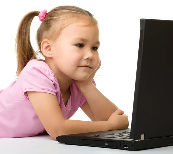 Little girl with laptop Royalty Free Stock Images