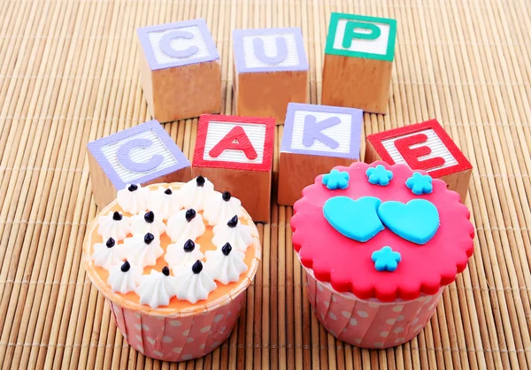 Cup cake with word — Stock Photo, Image