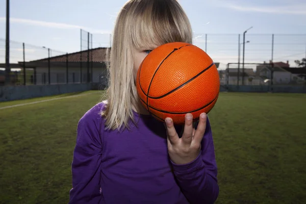 Girl with a basketball — Stock Photo, Image