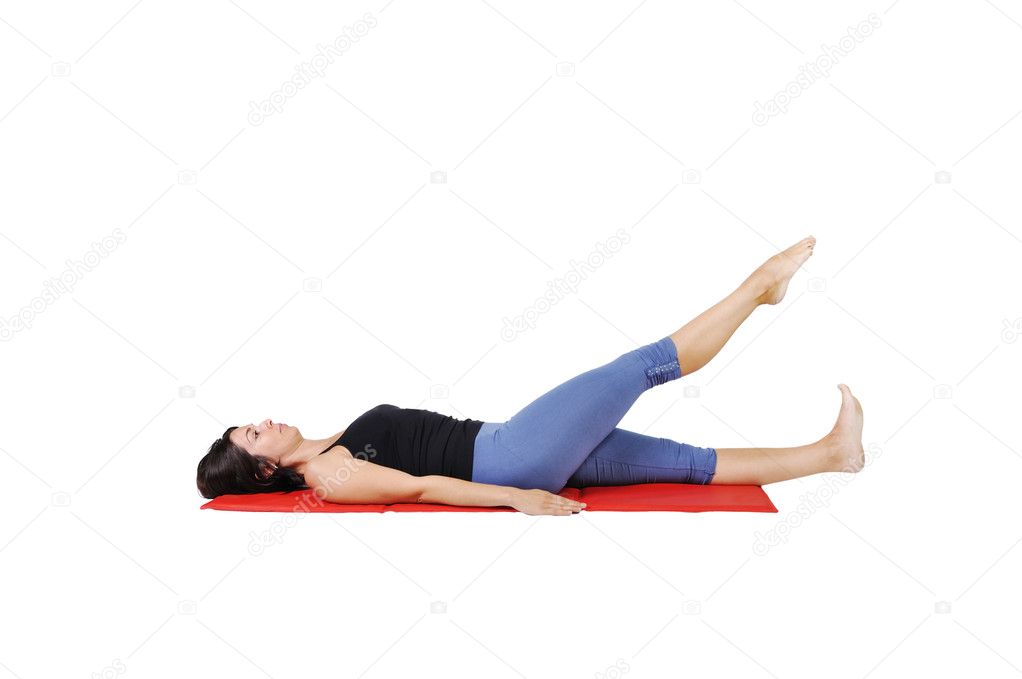 Fit young female pilates instructor showing different exercises on a white background