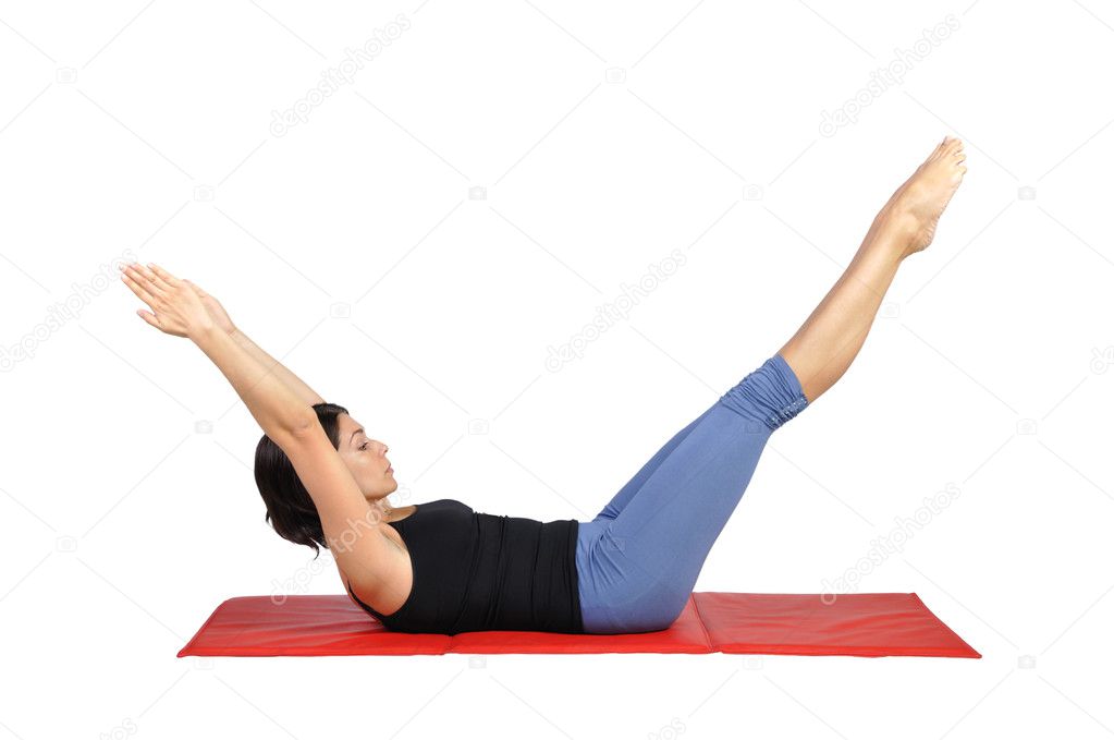 Fit young female pilates instructor showing different exercises on a white background