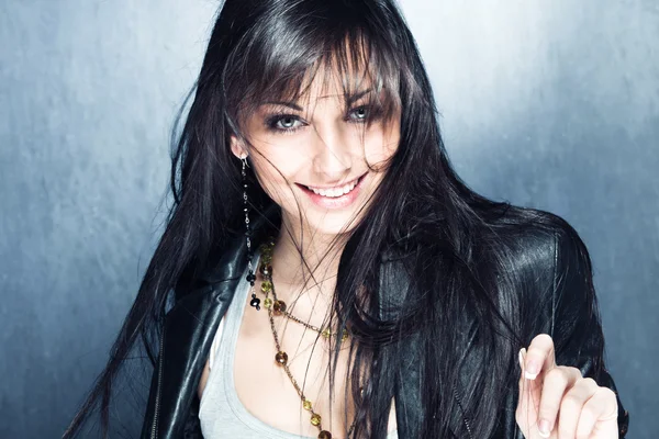 Smiling long black hair girl with blue eyes — Zdjęcie stockowe