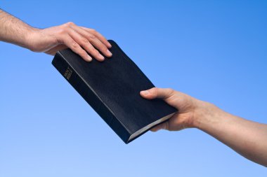 Hand Giving Bible clipart