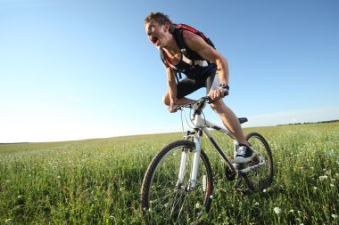 Man riding on bycycle clipart