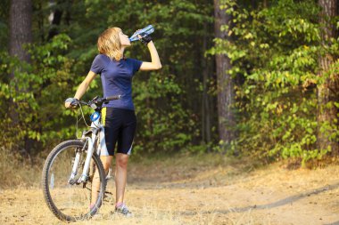 Biker in a park clipart