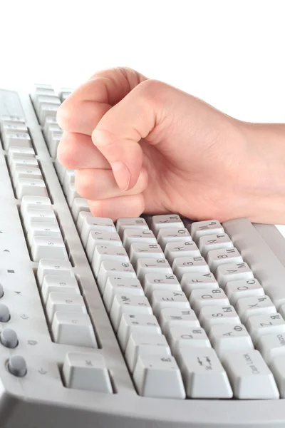 Клавиатура и кулак — стоковое фото