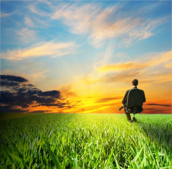 Sunset and man on chair — Stock Photo, Image