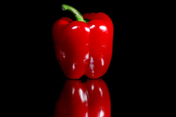 Red pepper on black background — Stock Photo, Image
