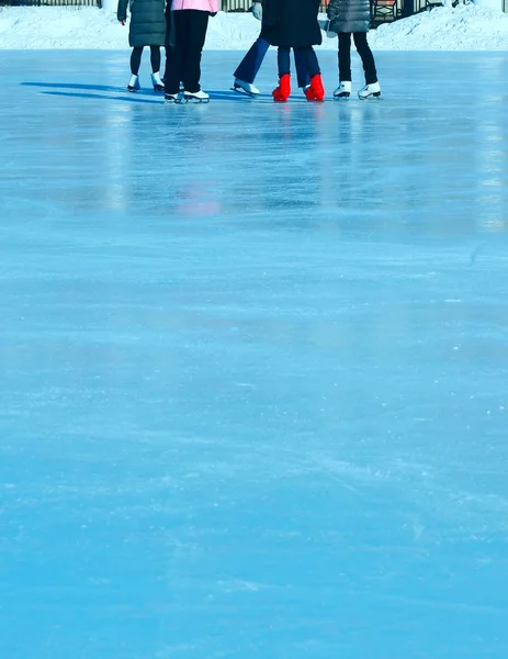 Scaters on blue ice — Stock Photo, Image