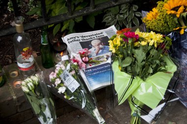 LONDON - JULY 27: Her fans pay tribute to Amy Winehouse clipart