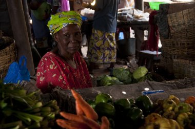 Shopkeeper selling vegetables in Bamako clipart