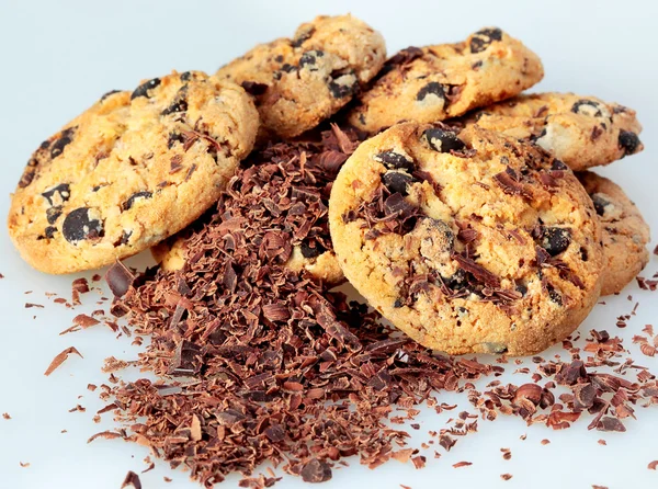 Oatmeal cookies and a shabby black chocolate — Stock Photo, Image