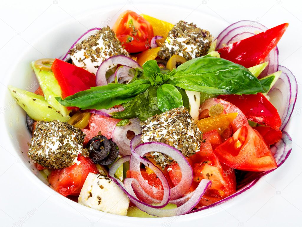 Greek salad - chopped fresh vegetables, olives, feta cheese, spi