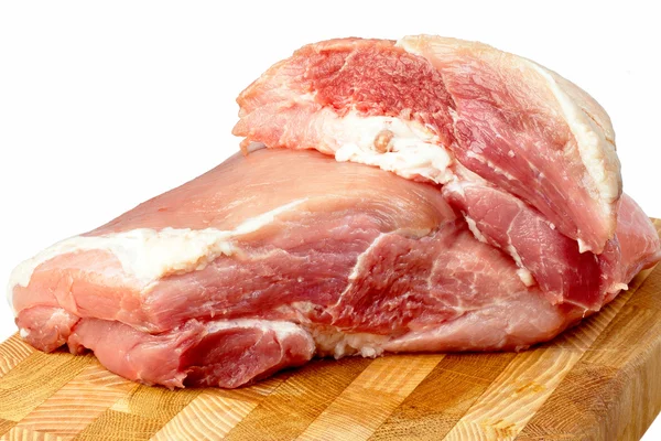 Kawałek wieprzowiny na desce do krojenia — Zdjęcie stockowe