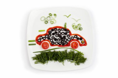 Concept of healthy eating - plate with vegetables as car goes on clipart