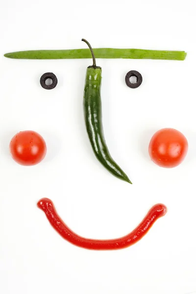 stock image Fragment of smiling plate with a vegetable mug. A cheerful break